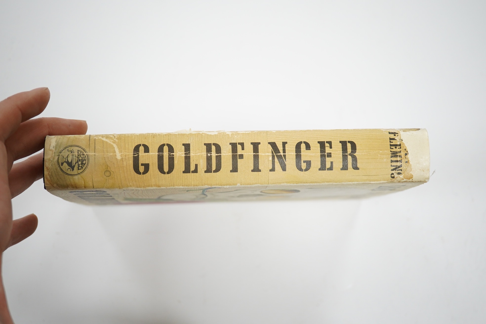 Fleming, Ian - Goldfinger. First Edition (1st impression, 2nd issue). pictorial text map, half title; publisher's black cloth, upper cover blocked in pictorial gilt and blind, d/wrapper. 1959